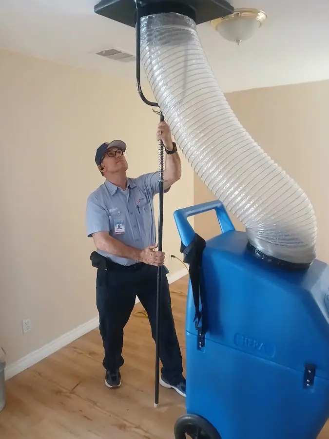 Furnace Tune-Up technician using HEPA equipment in Caribou